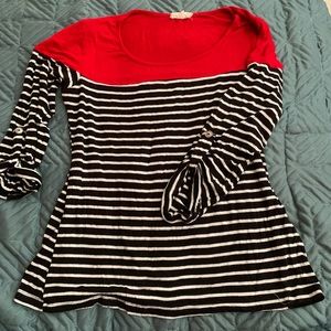 Cute black with white stripes, and red shirt